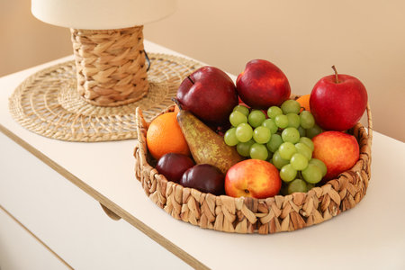 Fruit basket on commode in living room, closeupの写真素材