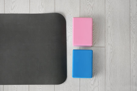Blocks with yoga mat on floor, top viewの写真素材