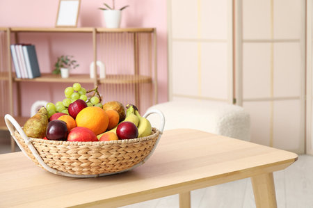 Fruit basket on coffee table in living room, closeupの写真素材