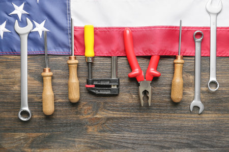 Composition with different tools and USA flag on wooden background. labor day celebrationの写真素材