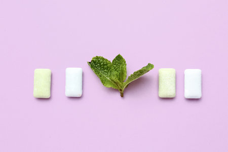 Fresh chewing gums with mint on lilac backgroundの写真素材