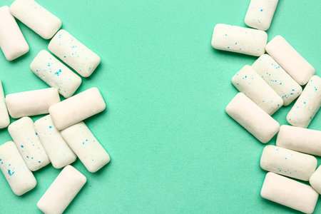 Fresh chewing gums on turquoise backgroundの写真素材