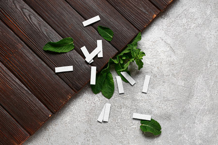 Fresh chewing gums with mint on wooden and grunge backgroundの写真素材