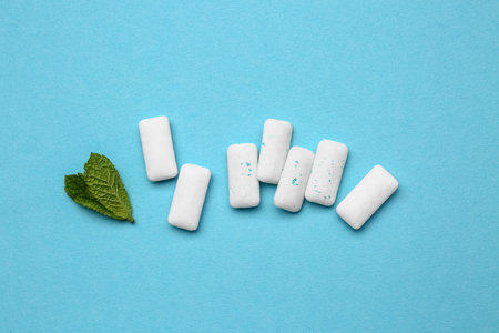 Fresh chewing gums with mint on blue backgroundの写真素材