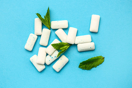 Fresh chewing gums with mint on blue backgroundの写真素材