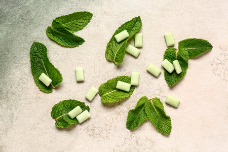 Fresh chewing gums with mint on grunge background