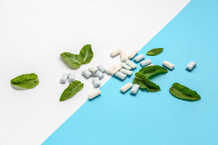 Fresh chewing gums with mint on colorful backgroundの写真素材