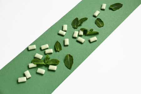 Fresh chewing gums with mint on colorful background