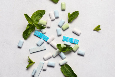 Fresh chewing gums with mint on white backgroundの写真素材