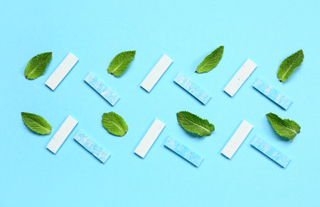 Fresh chewing gums with mint on blue backgroundの写真素材