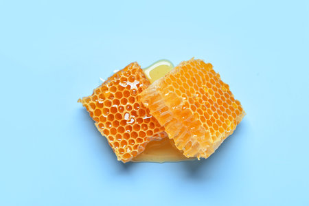 Sweet honeycombs on blue backgroundの写真素材