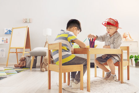 Cute little boys drawing at homeの写真素材