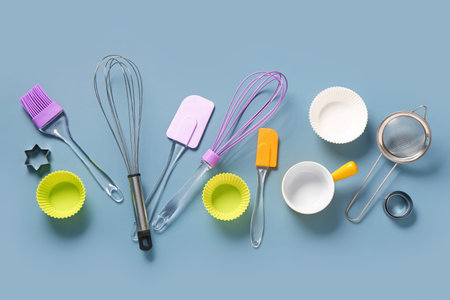 Baking utensils on blue background