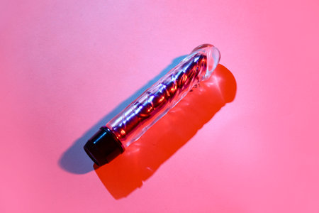 Vibrator from sex shop on red background