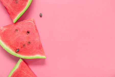 Pieces of ripe watermelon on pink background, closeupの写真素材