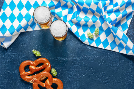 Flag of Bavaria, mugs with beer and pretzels on blue backgroundの写真素材