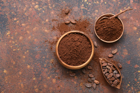 Bowls with cocoa powder and beans on grunge backgroundの写真素材