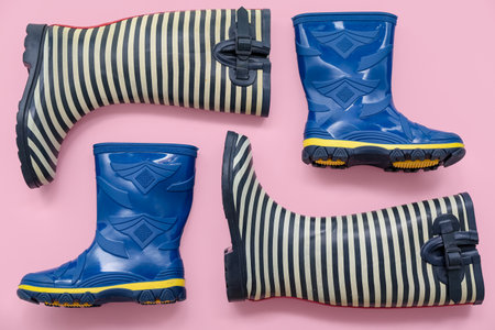Different gumboots on pink backgroundの写真素材
