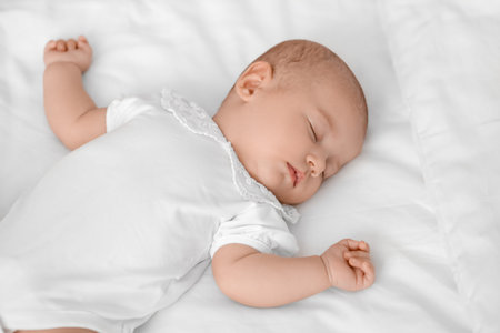 Little baby sleeping on bed, closeup