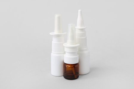 Bottles of nasal drops on gray backgroundの写真素材