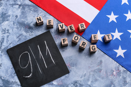 USA flag and card with date of National Day of Prayer and Remembrance for the Victims of the...