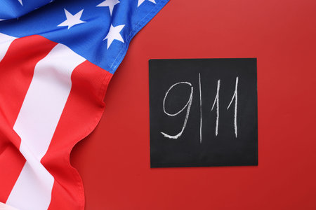 USA flag and card with date of National Day of Prayer and Remembrance for the Victims of the...