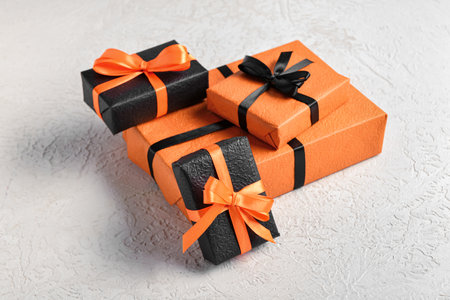 Gift boxes for Halloween celebration on textured gray backgroundの写真素材