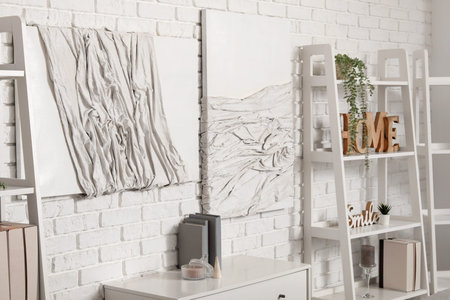 3D paintings on white brick wall in room