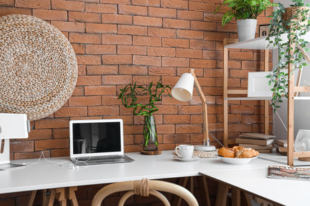 Interior of office with modern workplace and houseplantsの写真素材