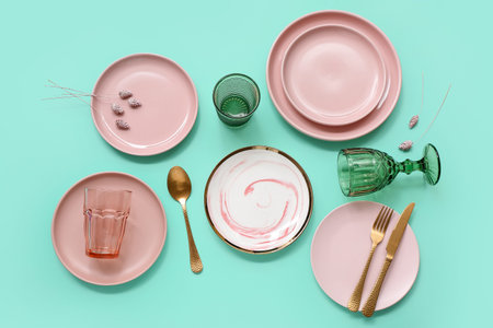 Beautiful table setting on turquoise background