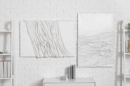 3D paintings on white brick wall in roomの写真素材