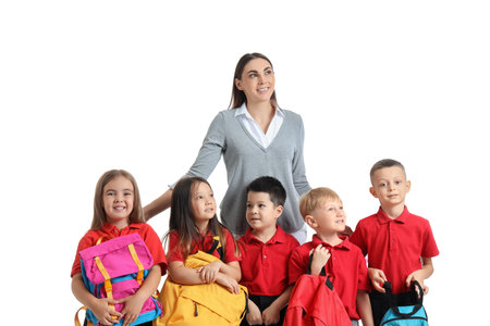 Little school children with female teacher on white backgroundの写真素材