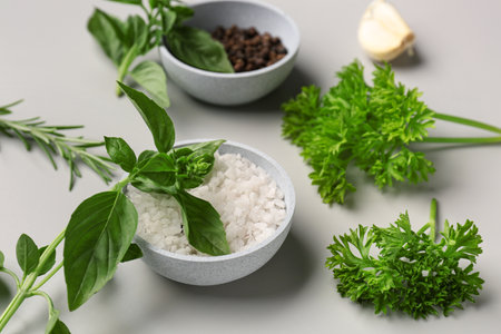 Composition with fresh herbs and spices on gray background, closeupの写真素材