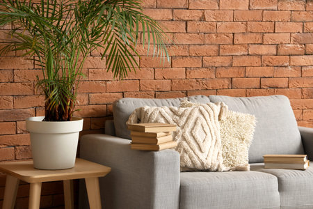 Stack of books on sofa in living room