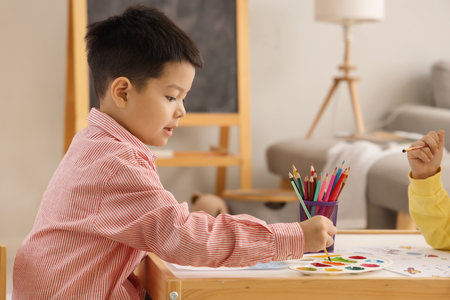 Cute little boys drawing at homeの写真素材