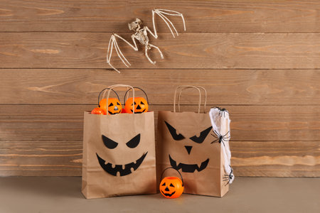 Shopping bag with decorations for Halloween on tableの写真素材