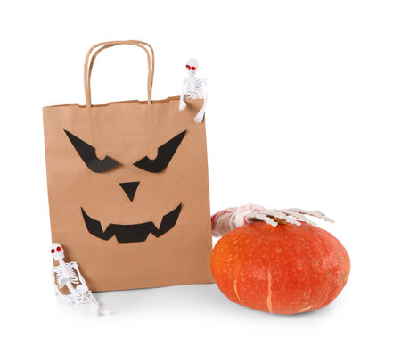 Shopping bag with decorations for Halloween on white backgroundの写真素材