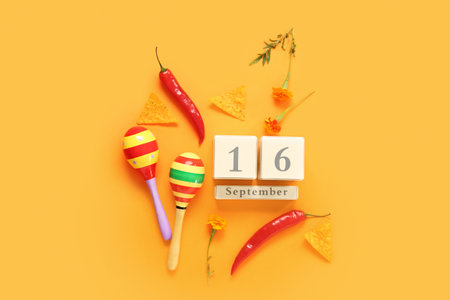 Date of Mexico's Independence Day with symbols on orange backgroundの写真素材