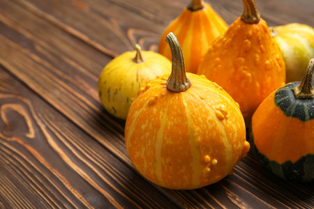 Fresh pumpkins on wooden backgroundの写真素材