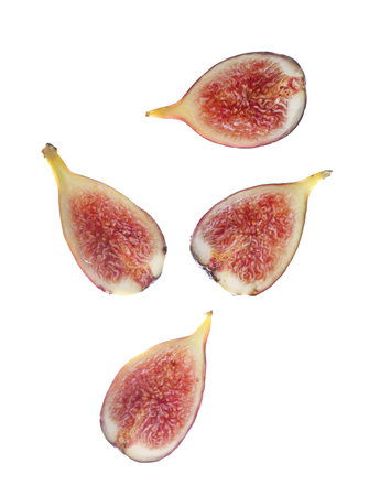 Flying pieces of fresh ripe fig on white background