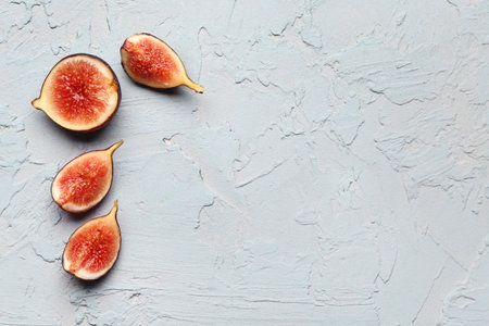 Cut fresh figs on blue backgroundの写真素材