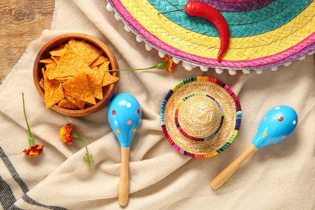 Poncho with food and Mexican symbols for Independence Day on wooden backgroundの写真素材