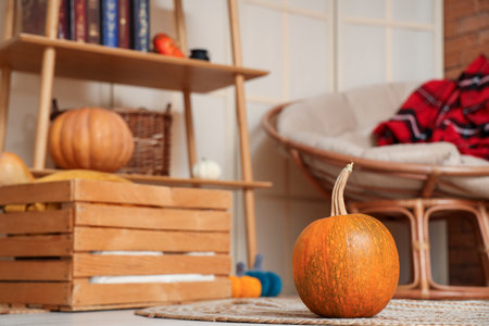 Halloween pumpkin on floor in living room, closeupの写真素材