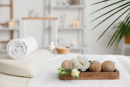 Spa composition with massage balls on couch in salon, closeupの写真素材