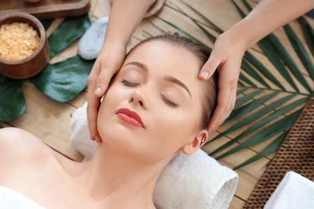 Young woman getting massage in spa salon, closeupの写真素材