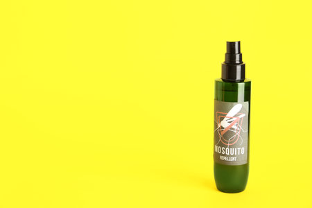 Mosquito repellent spray on yellow backgroundの写真素材