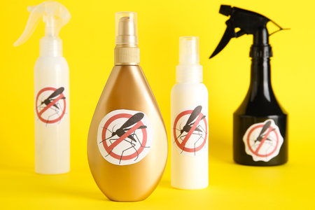 Mosquito repellent products on yellow backgroundの写真素材