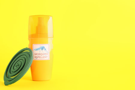 Mosquito repellent products on yellow backgroundの写真素材