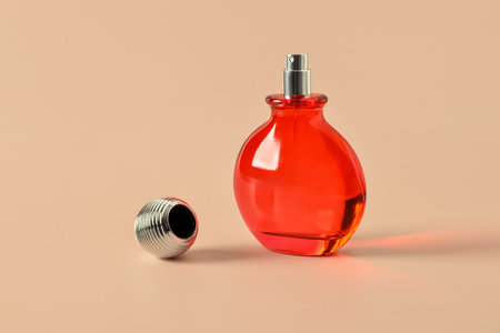 Bottle of luxury perfume on beige backgroundの写真素材