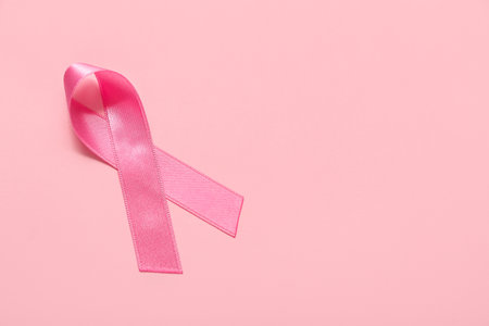 Pink ribbon on color background. breast cancer awareness conceptの写真素材